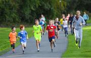 16 September 2018; Action from the Marlay Junior parkrun, at Marley Park in Dublin, where Vhi hosted a special event to celebrate their partnership with parkrun Ireland. Vhi hosted a lively warm up routine which was great fun for children and adults alike. Crossing the finish line was a special experience as children were showered with bubbles and streamers to celebrate their achievement and each child received a gift. Junior parkrun in partnership with Vhi support local communities in organising free, weekly, timed 2km runs every Sunday at 9.30am. To register for a parkrun near you visit www.parkrun.ie. Photo by Piaras Ó Mídheach/Sportsfile