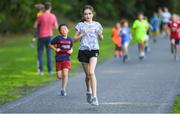 16 September 2018; Action from the Marlay Junior parkrun, at Marley Park in Dublin, where Vhi hosted a special event to celebrate their partnership with parkrun Ireland. Vhi hosted a lively warm up routine which was great fun for children and adults alike. Crossing the finish line was a special experience as children were showered with bubbles and streamers to celebrate their achievement and each child received a gift. Junior parkrun in partnership with Vhi support local communities in organising free, weekly, timed 2km runs every Sunday at 9.30am. To register for a parkrun near you visit www.parkrun.ie. Photo by Piaras Ó Mídheach/Sportsfile