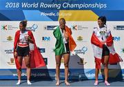 16 September 2018; Sanita Puspure of Ireland, centre, reacts on the podium following her victory in the Women's Single Sculls Final on day eight of the World Rowing Championships in Plovdiv, Bulgaria. Photo by Seb Daly/Sportsfile