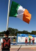 16 September 2018; Sanita Puspure of Ireland, centre, watches as the tricolour flag is raised following her victory in the Women's Single Sculls Final on day eight of the World Rowing Championships in Plovdiv, Bulgaria. Photo by Seb Daly/Sportsfile