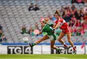 16 September 2018; Rebecca Delee of Limerick shoots to score her side's fifth goal despiite the efforts of Sinead Woods of Louth during the TG4 All-Ireland Ladies Football Junior Championship Final match between Limerick and Louth at Croke Park, Dublin. Photo by Eóin Noonan/Sportsfile