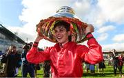 16 September 2018; Jockey Ronan Whelan celebrates with the Moyglare Stud Stakes trophy after winning The Moyglare Stud Stakes on Skitter Scatter at the Curragh Races on St Ledger Day at the Curragh Racecourse in Curragh, Kildare. Photo by Matt Browne/Sportsfile