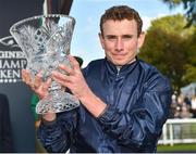 16 September 2018; Jockey Ryan Moore with the cup after winning The Comer Group International Irish St. Leger on Flag of Honour at the Curragh Races - St Ledger Day at the Curragh Racecourse in Curragh, Kildare. Photo by Matt Browne/Sportsfile