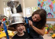 17 September 2018; Noëlle Healy of Dublin and Zach Ring, age 8, from Swords in Dublin, with the Brendan Martin Cup during the TG4 All-Ireland Senior Ladies Football Champions visit to Our Lady’s Children’s Hospital Crumlin, in Dublin. Photo by Piaras Ó Mídheach/Sportsfile