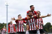 16 September 2018; Darren Cole, centre, celebrates with his Derry City team-mates Aaron McEneff, top, and Ronan Hale, left, after scoring his side's second goal during the EA SPORTS Cup Final between Derry City and Cobh Ramblers at the Brandywell Stadium in Derry. Photo by Stephen McCarthy/Sportsfile