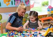 17 September 2018; Dublin footballer Carla Rowe with Anna May Shields, age 3, from Portlaoise in Laois, during the TG4 All-Ireland Senior Ladies Football Champions visit to Our Lady’s Children’s Hospital Crumlin, in Dublin. Photo by Piaras Ó Mídheach/Sportsfile