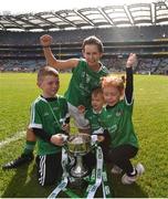 16 September 2018; Dymphna O'Brien of Limerick with, from left, Ross Philips, age 7, Ronan Healy, age 3 and Klara Philips, age 6, following the TG4 All-Ireland Ladies Football Junior Championship Final match between Limerick and Louth at Croke Park, Dublin. Photo by David Fitzgerald/Sportsfile