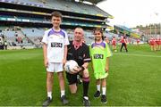 16 September 2018; Referee Niall McCormack being presented with the match ball by Serena Akbulut, St Enda’s Whitefriar St, Dublin, and Harry Martin, Star of The Sea NS, Sandymount, Dublin, ahead of the TG4 All-Ireland Ladies Football Junior Championship Final match between Limerick and Louth at Croke Park, Dublin. Photo by Eóin Noonan/Sportsfile