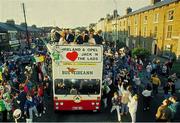June 1990. The Republic of Ireland players are greeted by supporters as the squad bus makes its way through the streets of Dublin during the homecoming from the 1990 World Cup Finals in Italy. Photo by  Ray McManus/Sportsfile