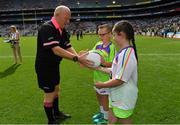 16 September 2018; Referee Gerry Carmody is presented with the match ball by match ball carriers Mya McAuley, and Alex Norman, both from St Joseph’s NS, East Wall, Dublin, prior to the TG4 All-Ireland Ladies Football Intermediate Championship Final match between Meath and Tyrone at Croke Park, Dublin. Photo by Brendan Moran/Sportsfile