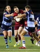 21 September 2018; Rory Scannell of Munster is tackled by Jason Harries, left, and Kristian Dacey of Cardiff Blues during the Guinness PRO14 Round 4 match between Cardiff Blues and Munster at Cardiff Arms Park in Cardiff, Wales. Photo by Chris Fairweather/Sportsfile