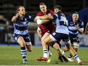 21 September 2018; Rory Scannell of Munster is tackled by Jason Harries, left, and Kristian Dacey of Cardiff Blues during the Guinness PRO14 Round 4 match between Cardiff Blues and Munster at Cardiff Arms Park in Cardiff, Wales. Photo by Chris Fairweather/Sportsfile