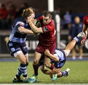 21 September 2018; JJ Hanrahan of Munster is tackled by Kristian Dacey, left, and Ellis Jenkins of Cardiff Blue during the Guinness PRO14 Round 4 match between Cardiff Blues and Munster at Cardiff Arms Park in Cardiff, Wales. Photo by Chris Fairweather/Sportsfile