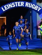 22 September 2018; Matchday mascots 7 year old James Brady, from Greystones, Co. Wicklow, and 8 year old Paul Hartnett, from Blackrock, Dublin, run out with Leinster captain Jonathan Sexton ahead of the Guinness PRO14 Round 4 match between Leinster and Edinburgh at RDS Arena in Dublin. Photo by Ramsey Cardy/Sportsfile