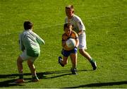 23 September 2018; Luke Farrell, of Glencar Manorhamilton, Co Leitrim, in action against Cathal Dempsey, left, Jonathan Groenewald of St Barry's, Co Roscommon, during the Littlewoods Ireland Connacht Provincial Days Go Games in Croke Park. This year over 6,000 boys and girls aged between six and eleven represented their clubs in a series of mini blitzes and – just like their heroes – got to play in Croke Park. For exclusive content and behind the scenes action follow Littlewoods Ireland on Facebook, Instagram, Twitter and https://blog.littlewoodsireland.ie/ Photo by Piaras Ó Mídheach/Sportsfile