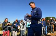 25 September 2018; Rory McIlroy of Europe signs autographs on his way to the 14th tee box during a practice round ahead of the Ryder Cup 2018 Matches at Le Golf National in Paris, France. Photo by Ramsey Cardy/Sportsfile