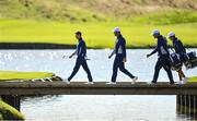 25 September 2018; Europe team members, from left, Rory McIlroy, Jon Rahm, Jon Rahm's caddie Adam Hayes, and Rory McIlroy's caddie Harry Diamond approach the 15th green during a practice round ahead of the Ryder Cup 2018 Matches at Le Golf National in Paris, France. Photo by Ramsey Cardy/Sportsfile
