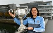 25 September 2018; Dublin Footballer Paul Mannion and Ladies footballer Lyndsey Davey, along with the Sam Maguire and Brendan Martin Cups, were at AIG Insurance’s head office in Dublin today to mark Dublin's All-Ireland wins. AIG’s chosen charity for 2018, Aoibheann’s Pink Tie, also joined in the celebrations and were presented with a signed Dublin GAA jersey. In attendance at the AIG Cups visit is Dublin Ladies footballer Lyndsey Davey with the Brendan Martin Cup at AIG Offices in Dublin. Photo by Sam Barnes/Sportsfile