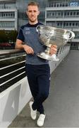 25 September 2018; Dublin Footballer Paul Mannion and Ladies footballer Lyndsey Davey, along with the Sam Maguire and Brendan Martin Cups, were at AIG Insurance’s head office in Dublin today to mark Dublin's All-Ireland wins. AIG’s chosen charity for 2018, Aoibheann’s Pink Tie, also joined in the celebrations and were presented with a signed Dublin GAA jersey. In attendance at the AIG Cups visit is Dublin footballer Paul Mannion with the Sam Maguire Cup at AIG Offices in Dublin. Photo by Sam Barnes/Sportsfile
