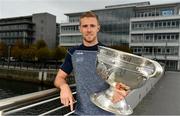 25 September 2018; Dublin Footballer Paul Mannion and Ladies footballer Lyndsey Davey, along with the Sam Maguire and Brendan Martin Cups, were at AIG Insurance’s head office in Dublin today to mark Dublin's All-Ireland wins. AIG’s chosen charity for 2018, Aoibheann’s Pink Tie, also joined in the celebrations and were presented with a signed Dublin GAA jersey. In attendance at the AIG Cups visit is Dublin footballer Paul Mannion with the Sam Maguire Cup at AIG Offices in Dublin. Photo by Sam Barnes/Sportsfile