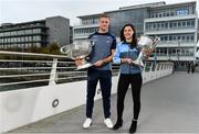 25 September 2018; Dublin Footballer Paul Mannion and Ladies footballer Lyndsey Davey, along with the Sam Maguire and Brendan Martin Cups, were at AIG Insurance’s head office in Dublin today to mark Dublin's All-Ireland wins. AIG’s chosen charity for 2018, Aoibheann’s Pink Tie, also joined in the celebrations and were presented with a signed Dublin GAA jersey. In attendance at the AIG Cups visit are Dublin footballer Paul Mannion and Dublin ladies footballer Lyndsey Davey with the Sam Maguire and Brendan Martin Cups at AIG Offices in Dublin. Photo by Sam Barnes/Sportsfile