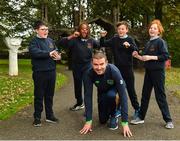 25 September 2018; Minister of State for Tourism and Sport Brendan Griffin T.D, centre, is encouraged by pupils of Scoil Muire Gan Smal, from left, Adam Cooney, age 10, Stephanie Omozusi, age 10, Rosamund McGreevy, age 11, and Louis Wright, age 11, during the The Daily Mile Media Day at Scoil Muire Gan Smal in Inchicore, Dublin. Photo by Seb Daly/Sportsfile