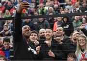 25 September 2018; Dion Dublin of Manchester United Legends takes a selfie with fans at half-time during the Liam Miller Memorial match between Manchester United Legends and Republic of Ireland & Celtic Legends at Páirc Uí Chaoimh in Cork. Photo by David Fitzgerald/Sportsfile