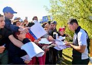 26 September 2018; Rory McIlroy of Europe signs autographs during a practice round prior to the Ryder Cup 2018 Matches at Le Golf National in Paris, France. Photo by Ramsey Cardy/Sportsfile