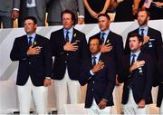 27 September 2018; Members of the USA team, from left, Patrick Reed, Phil Mickelson, Tiger Woods, Brooks Koepka, Bubba Watson and Dustin Johnson stand for their national anthem during the Opening Ceremony prior to the Ryder Cup 2018 Matches at Le Golf National in Paris, France. Photo by Ramsey Cardy/Sportsfile