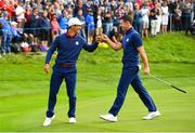 28 September 2018; Thorbjørn Olesen, left, and Rory McIlroy of Europe reacts after winning the 8th hole during his Fourball Match against Dustin Johnson and Rickie Fowler of USA during the Ryder Cup 2018 Matches at Le Golf National in Paris, France. Photo by Ramsey Cardy/Sportsfile
