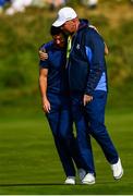 28 September 2018; Rory McIlroy of Europe, left, and Europe captain Thomas Bjørn walk off the 16th green following their Fourball Match defeat against Dustin Johnson and Rickie Fowler of USA during the Ryder Cup 2018 Matches at Le Golf National in Paris, France. Photo by Ramsey Cardy/Sportsfile