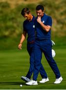 28 September 2018; Thorbjørn Olesen, left, and Rory McIlroy of Europe walk off the 16th green following their Fourball Match defeat against Dustin Johnson and Rickie Fowler of USA during the Ryder Cup 2018 Matches at Le Golf National in Paris, France. Photo by Ramsey Cardy/Sportsfile
