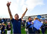 28 September 2018; Rory McIlroy, left, and Ian Poulter's son, Luke, watch the big screen as Francesco Molinari and Tommy Fleetwood of Europe win their Afternoon Foursome Match against Justin Thomas and Jordan Spieth of USA during the Ryder Cup 2018 Matches at Le Golf National in Paris, France. Photo by Ramsey Cardy/Sportsfile