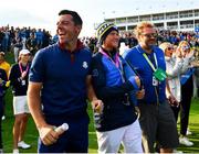 28 September 2018; Rory McIlroy, left, and Ian Poulter's son, Luke, watch the big screen as Francesco Molinari and Tommy Fleetwood of Europe win their Afternoon Foursome Match against Justin Thomas and Jordan Spieth of USA during the Ryder Cup 2018 Matches at Le Golf National in Paris, France. Photo by Ramsey Cardy/Sportsfile