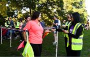 29 September 2018; Vhi staff and voluntter Angela Walsh scans barcodes  at the Vhi staff takeover at Kilkenny parkrun. Vhi is also announcing a brand new adult parkrun Rewards Programme. Vhi customers can earn free rewards when they take part in adult parkruns across Ireland. Customers can claim their first reward after completing just one parkrun and as they accumulate parkruns they will unlock a variety of different rewards. Rewards include sports towels, LED running lights, phone holders and more. To sign up, participants simply download the Vhi app and scan their parkrun barcode. The Vhi Rewards Programme starts on September 29th and will run for 6 months initially. parkruns take place over a 5km course weekly, are free to enter and are open to all ages and abilities, providing a fun and safe environment to enjoy exercise. To register for a parkrun near you visit www.parkrun.ie. Photo by Harry Murphy/Sportsfile