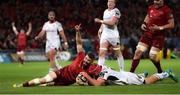 29 September 2018; Sam Arnold of Munster celebrates after scoring his side's seventh try despite the tackle of Eric O'Sullivan of Ulster during the Guinness PRO14 Round 5 match between Munster and Ulster at Thomond Park in Limerick. Photo by Matt Browne/Sportsfile