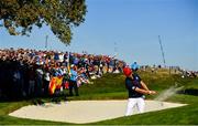 30 September 2018; Justin Thomas of USA plays a shot from the 3rd hole bunker during their Singles Match against Rory McIlroy of Europe during the Ryder Cup 2018 Matches at Le Golf National in Paris, France. Photo by Ramsey Cardy/Sportsfile