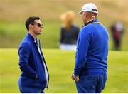 30 September 2018; Rory McIlroy of Europe, left, and Europe captain Thomas Bjørn following his Singles Match defeat against Justin Thomas of USA during the Ryder Cup 2018 Matches at Le Golf National in Paris, France. Photo by Ramsey Cardy/Sportsfile