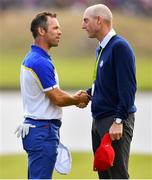 30 September 2018; Paul Casey of Europe, left, shakes hands with USA captain Jim Furyk on the 18th green during the Singles Match during the Ryder Cup 2018 Matches at Le Golf National in Paris, France. Photo by Ramsey Cardy/Sportsfile