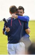 30 September 2018; Rory McIlroy of Europe congratulates Justin Thomas of USA on the 18th green following their Singles Match during the Ryder Cup 2018 Matches at Le Golf National in Paris, France. Photo by Ramsey Cardy/Sportsfile