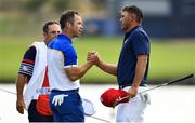 30 September 2018; Paul Casey of Europe, left, and Brooks Koepka of USA shake hands after sharing the point in their Singles Match during the Ryder Cup 2018 Matches at Le Golf National in Paris, France. Photo by Ramsey Cardy/Sportsfile