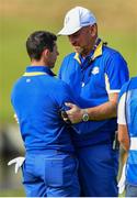 30 September 2018; Europe captain Thomas Bjørn consoles Rory McIlroy of Europe on the 18th fairway following his Singles Match defeat against Justin Thomas of USA during the Ryder Cup 2018 Matches at Le Golf National in Paris, France. Photo by Ramsey Cardy/Sportsfile