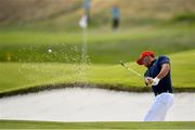 30 September 2018; Brooks Koepka of USA plays a shot from the 18th hole bunker during his Singles Match against Paul Casey of Europe during the Ryder Cup 2018 Matches at Le Golf National in Paris, France. Photo by Ramsey Cardy/Sportsfile