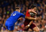6 October 2018; Joey Carbery of Munster is tackled by Ross Byrne of Leinster during the Guinness PRO14 Round 6 match between Leinster and Munster at the Aviva Stadium in Dublin. Photo by Seb Daly/Sportsfile