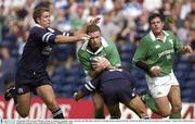 6 September 2003; Geordan Murphy, Ireland, is tackled by Scotland's Andy Craig, left, and Mike Blair, which led to Murphy being stretchered off with a broken leg. RBS World Cup Countdown test, Scotland v Ireland, Murrayfield Stadium, Edinburgh, Scotland. Picture credit; Brendan Moran / SPORTSFILE *EDI*