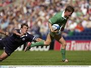 6 September 2003; Ronan O'Gara, Ireland, in action against Scotland's Andrew Mower. RBS World Cup Countdown test, Scotland v Ireland, Murrayfield Stadium, Edinburgh, Scotland. Picture credit; Brendan Moran / SPORTSFILE *EDI*