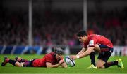 13 October 2018; Joey Carbery of Munster prepares to take a conversion to level the scores 10-10 with the help of team-ate Duncan Williams during the Heineken Champions Cup Pool 2 Round 1 match between Exeter and Munster at Sandy Park in Exeter, England. Photo by Brendan Moran/Sportsfile
