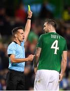 13 October 2018; Shane Duffy of Republic of Ireland is shown a yellow card by referee Javier Estrada during the UEFA Nations League B group four match between Republic of Ireland and Denmark at the Aviva Stadium in Dublin. Photo by Harry Murphy/Sportsfile