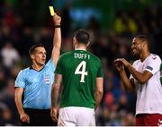 13 October 2018; Shane Duffy of Republic of Ireland is shown a yellow card by referee Javier Estrada during the UEFA Nations League B group four match between Republic of Ireland and Denmark at the Aviva Stadium in Dublin. Photo by Harry Murphy/Sportsfile