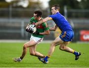 14 October 2018; Brian Stack of St Brigid's in action against Ronan Gavin of Clann na Gael during the Roscommon County Senior Club Football Championship Final match between Clann na Gael and St Brigid's at Dr Hyde Park in Roscommon. Photo by Barry Cregg/Sportsfile